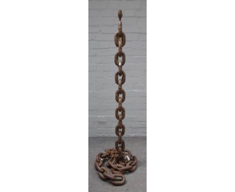 An unusual wrought iron standard lamp cast as large linked chains, 125cm high. 