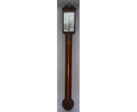 A mahogany and chequer strung stick barometer, late 19th century by A. Donegan, with broken arch pediment, rectangular silver