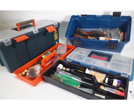 Two tackle boxes full of fly tying equipment, capes, furs, tools, and silks, (qty). 