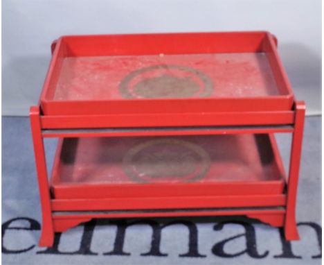 A 20th century red lacquer two tier side table with two butlers trays, 68cm wide x 49cm high.  Provenance; property from the 