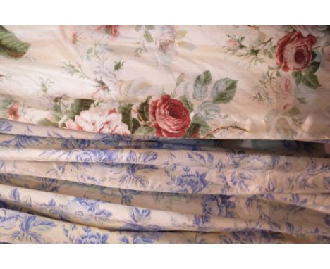 A pair of lined blue foliate curtains, 140cm wide x 252cm long, and a single lined and interlined curtain with rose decoratio