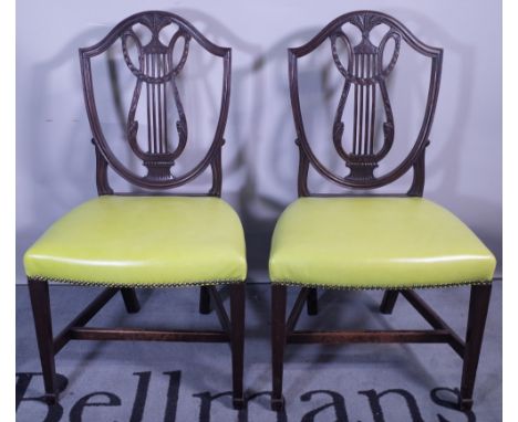 A pair of George III style mahogany shield back dining chairs and a Regency style dining chair, (3).  Provenance; property fr