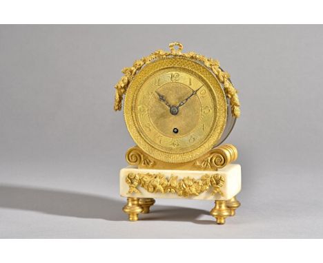 An Empire style ormolu and white marble mantel clock, late 19th century, with drum case over a marble plinth and four feet, 1