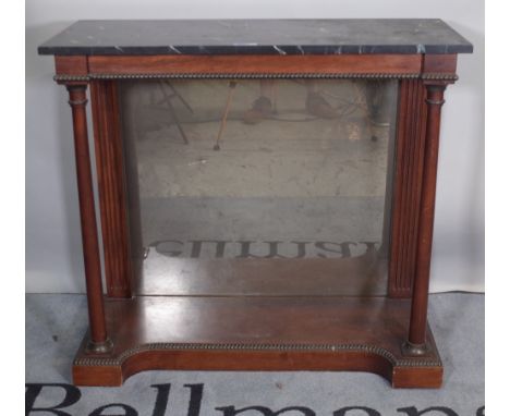 An Empire style mahogany console table with mirrored back and faux marble top, 94cm wide x 87cm high.