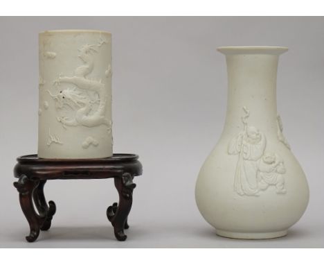 A Chinese white biscuit porcelain pear shaped vase, late 19th/20th century, moulded in relief with three figures and a deer, 