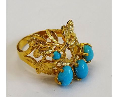 A gold and turquoise set ring, designed as a spray, claw set with three oval and with one smaller circular turquoise, ring si