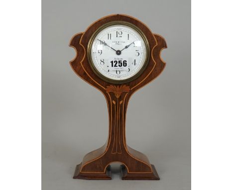 A mahogany and inlaid mantel clock of Art Nouveau design, the white enamel dial detailed John Kippen Crieff, (a.f.), 27cm hig