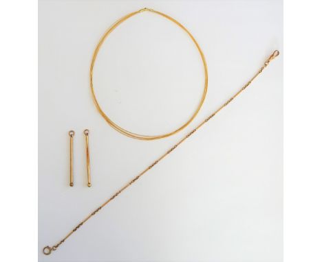 An 18ct gold necklace, in a seven row wirework design, weight 8.7 gms, a gold toothpick, detailed 9 CT, a gold toothpick, wit