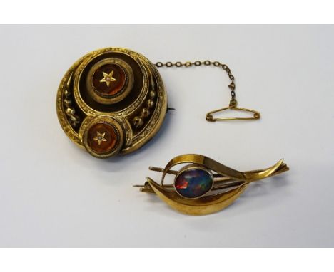 A Victorian gold, seed pearl and yellow gem set brooch, of circular form, the back glazed with a hair locket compartment and 