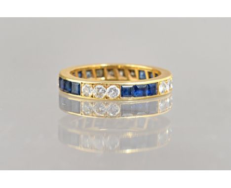 A gold, sapphire and diamond full eternity ring, mounted with rows of calibre cut sapphires, alternating with rows of circula