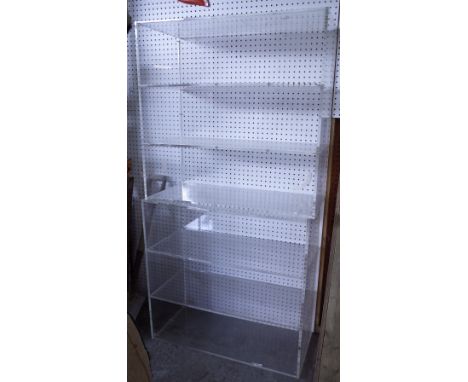 A pair of 20th century perspex three tier open bookcase, 101cm wide x 81cm high, (2).  Provenance; property from the late Sir