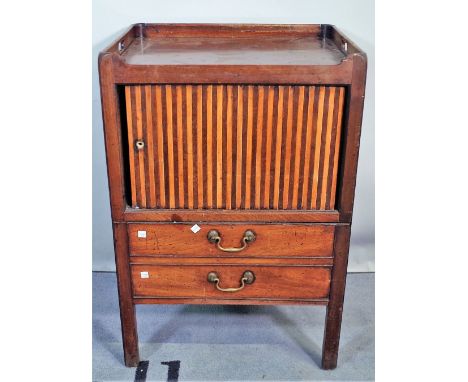 A George III mahogany tambour fronted commode, with galleried top, on block supports, 56cm wide x 83cm high. 