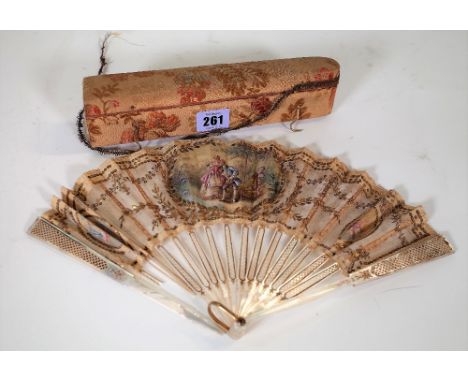 A 19th century mother-of-pearl and lace fan, cased. 
