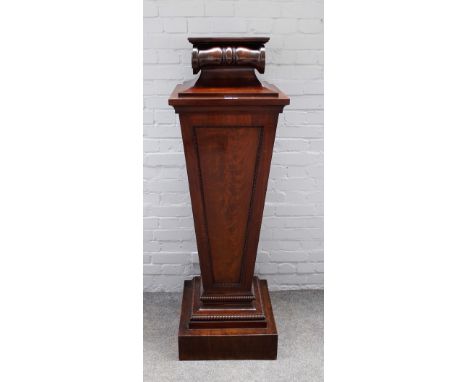 A mahogany pedestal, with scroll top over tapering square split bobbin mounted body, 49cm wide x 153cm high.