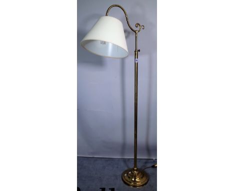 A 20th century brass adjustable standard lamp on plinth base, 156cm high. 