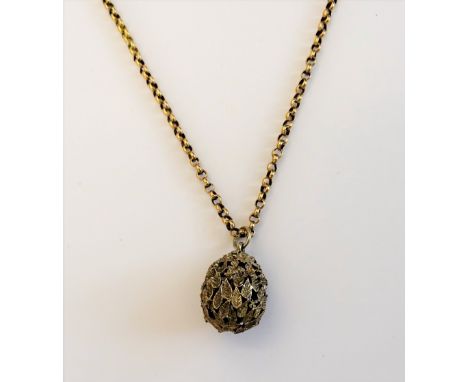 A Stuart Devlin, silver gilt egg shaped pendant, with foliate decoration, London 1987, with a gold circular link neckchain, o