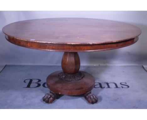 A Victorian mahogany circular dining able octagonal tapering column on plinth base supported by claw feet, 132cm wide x 78cm 