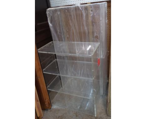 A pair of 20th century perspex three tier open bookcases, 101cm wide x 81cm high, (2).  Provenance; property from the late Si
