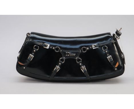 A Dior buckle embellished black patent leather clutch bag of curved rectangular shape and silver tone hardware, missing strap