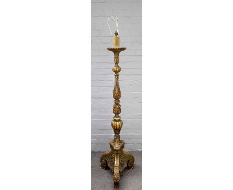 A parcel gilt and green painted standard lamp of 17th century Italian style, 157cm high.