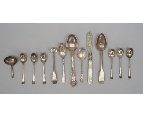 A George III silver caddy spoon, the bowl of oval form with engraved decoration, probably London 1800, a Victorian silver but
