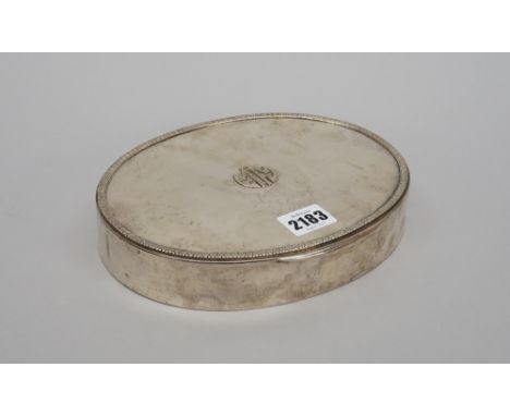 An oval hinge lidded trinket box, the cover initial applied and having a foliate border, textile lined within, detailed 800, 