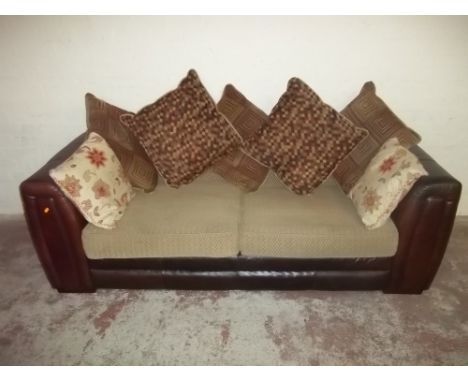 A LEATHER TWO SEATER SOFA WITH FABRIC CUSHIONS