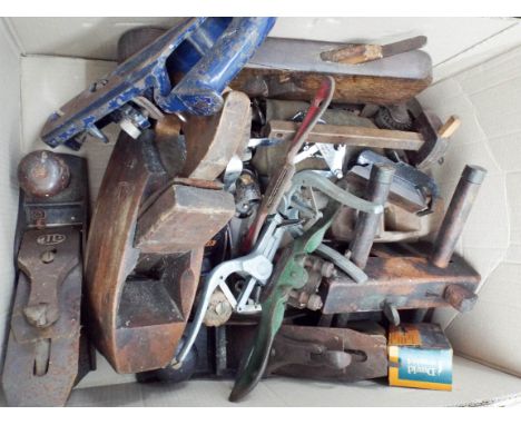 A box of old wood planes and other woodworking tools etc