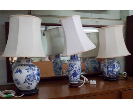 A collection of three oriental blue and white china lamp bases with shade 