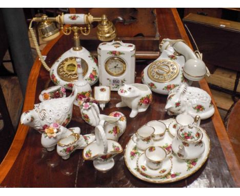 Two Royal Albert Old Country Rose telephones, mantel clock, miniature teaset, various ornamental items 