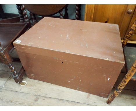 An old brown painted pine trunk 