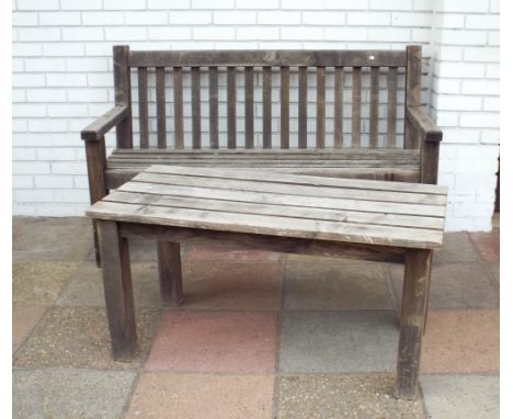 A teak garden bench seat with matching slatted coffee table 