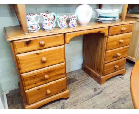 A varnished pine twin pedestal desk or dressing table 