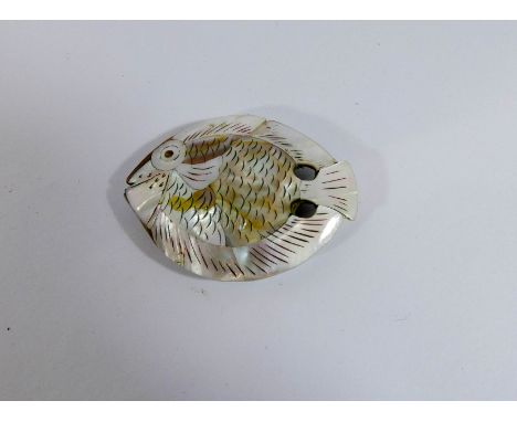 A Japanese carved mother of pearl fish shaped netsuke toggle, 5cm across