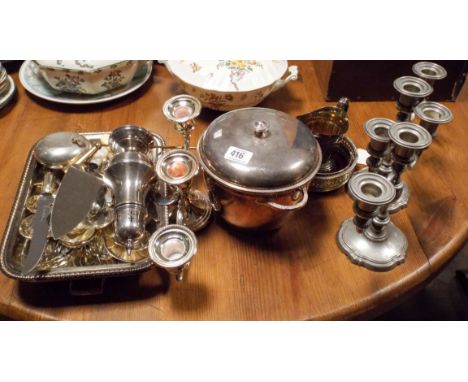 A pair of plated candelabra, sugar caster, cutlery and other plated items 