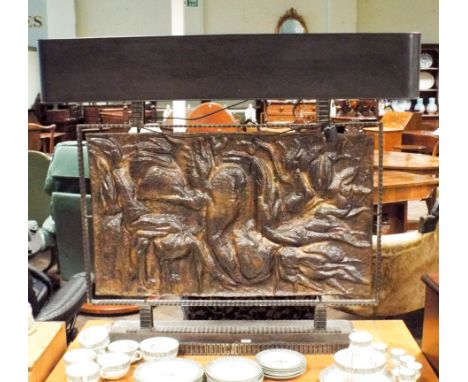 A large metal table lamp consisting of a geometric steel base and an decorative beaten and planished copper plate panel, appr