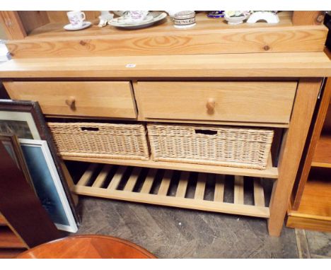 A light oak side cabinet fitted two drawers with two pull out basket drawers and shelf under 4' wide 