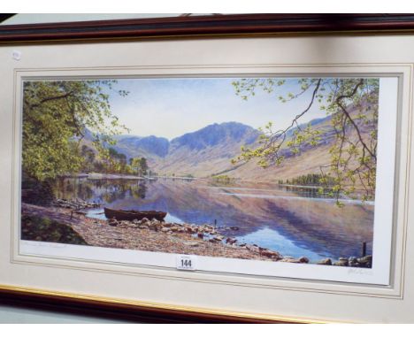 A signed print of a lake scene 