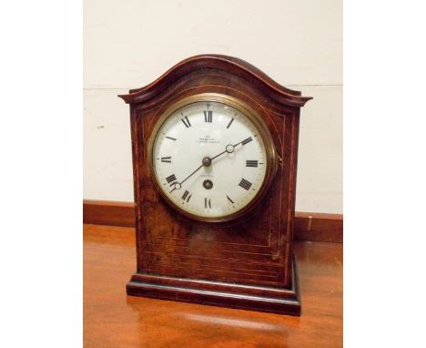 An Edwardian mantel clock in an inlaid mahogany case 