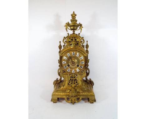 French gilt metal mantel clock with blue enamelled numerals applied to the dial, 15" tall