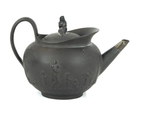 A late 18th/early 19th Century Wedgwood teapot Of circular form, relief decorated with classical maiden and children in lands