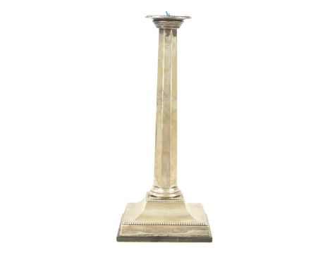 A silver table lamp baseThe circular beaded drip pan to a panelled tapered stem, raised on a beaded square base, with electri