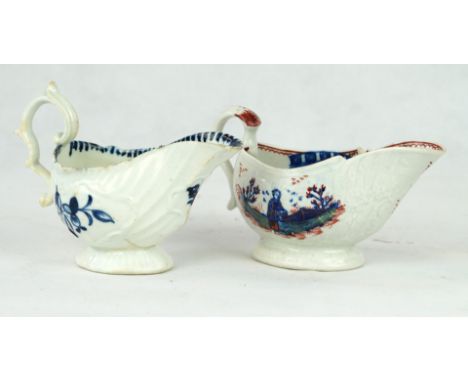 Two 18th Century Liverpool porcelain sauceboatsThe first example relief moulded and painted with blue foliate, height 10cm, t