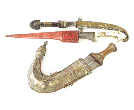 An Arabian Jambiya late 19th/early 20th Century20cm curved double edged blade, leather covered grip with white metal and bras