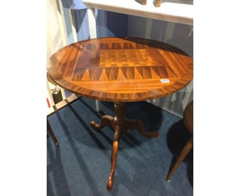 A reproduction mahogany chess top table by D. M. Christian, the top crossbanded, below a bird cage action and tripod base, 67