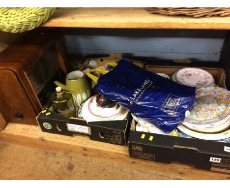 A shelf of assorted, to include a radio