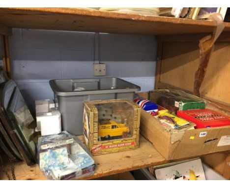 A shelf of assorted, toys including boxed Only Fools and Horses.