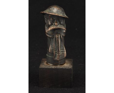 A vintage bronze Bruce Bairnsfather car mascot mounted on a metal stand. Circa 1914-1918. 9cms tall.Please note this lot has 