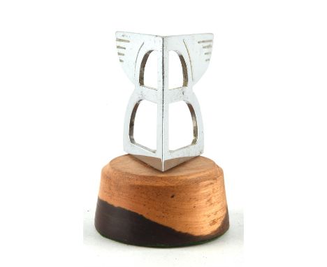Arrow shaped chrome Bentley Flying B wings car mascot mounted on wood stand. 10cms tall. Please note this lot has the standar