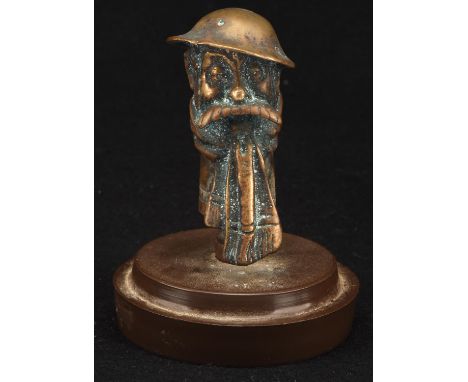 A vintage brass Bruce Bairnsfather car mascot mounted on a plastic stand. Circa 1914-1918. 9cms tall. Please note this lot ha
